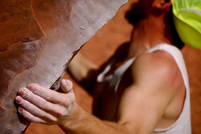 close up of a rock climber's hand while climbing